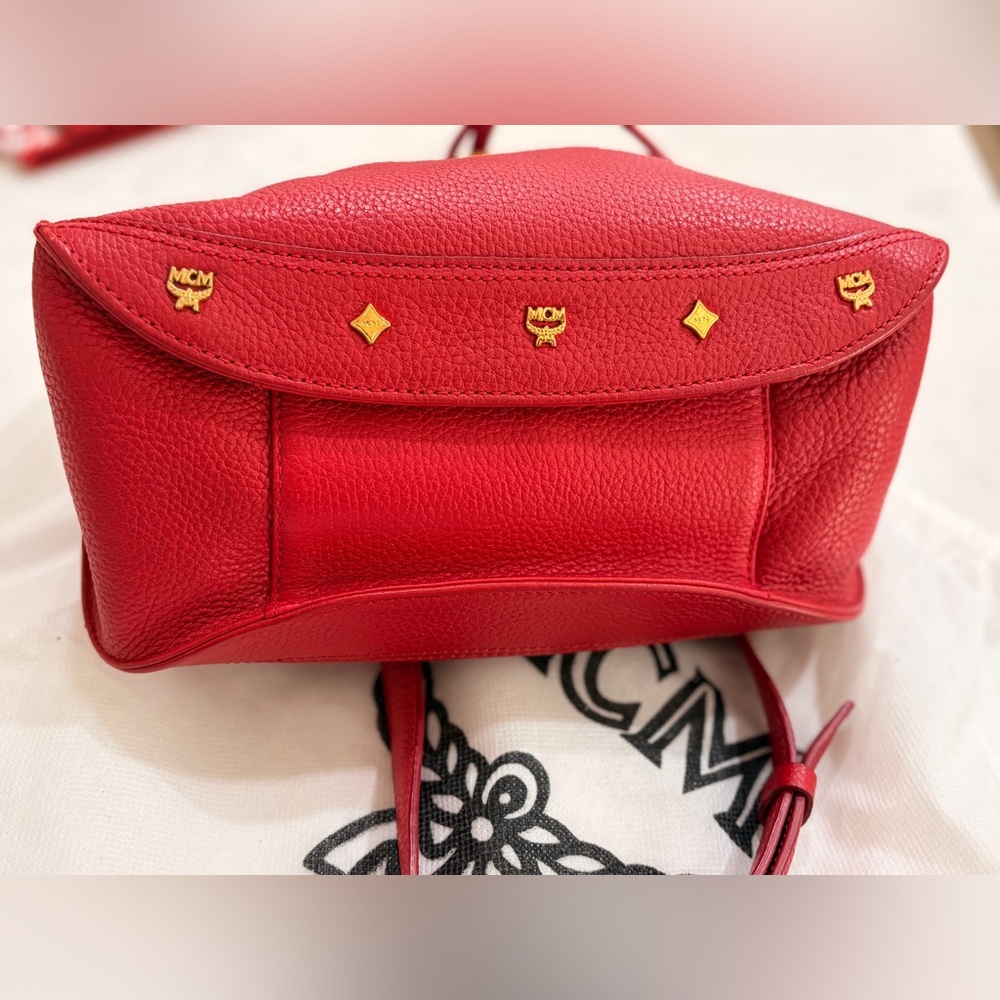 MCM Red Leather Bucket Bag
Crossbody Drawstring Gold Hardware - Picture 9 of 17